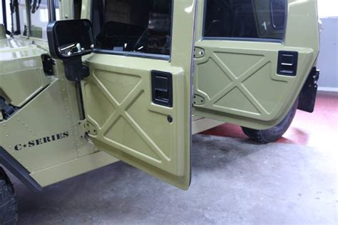 This includes the extra heavy duty 1/4” tactical hard top and roof grab rails. . Humvee door kit